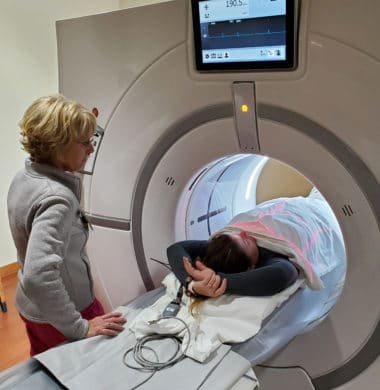 person undergoing a CT scan as part of a calcium heart score test