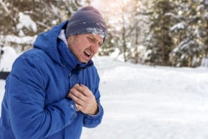 man suffering a heart attack in the cold weather