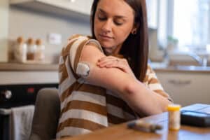 woman managing diabetes with an insulin pump 