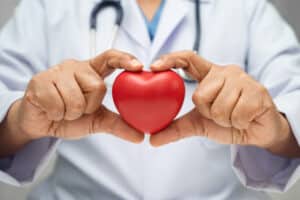 cardiologist holding a heart
