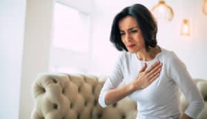 woman with chest pain during a heart attack