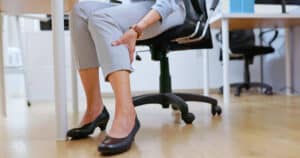 woman with calf pain from a heart condition