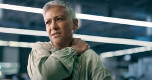 woman with shoulder pain caused by a heart condition