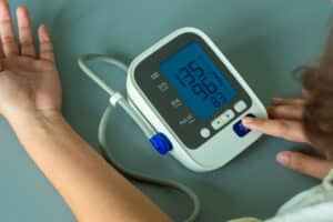 blood pressure monitor showing a high blood pressure reading