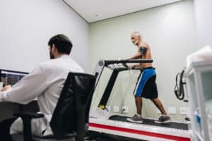 elderly man taking a cardiac stress test at a cardiology office