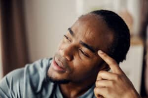 man sweating profusely due to heart disease